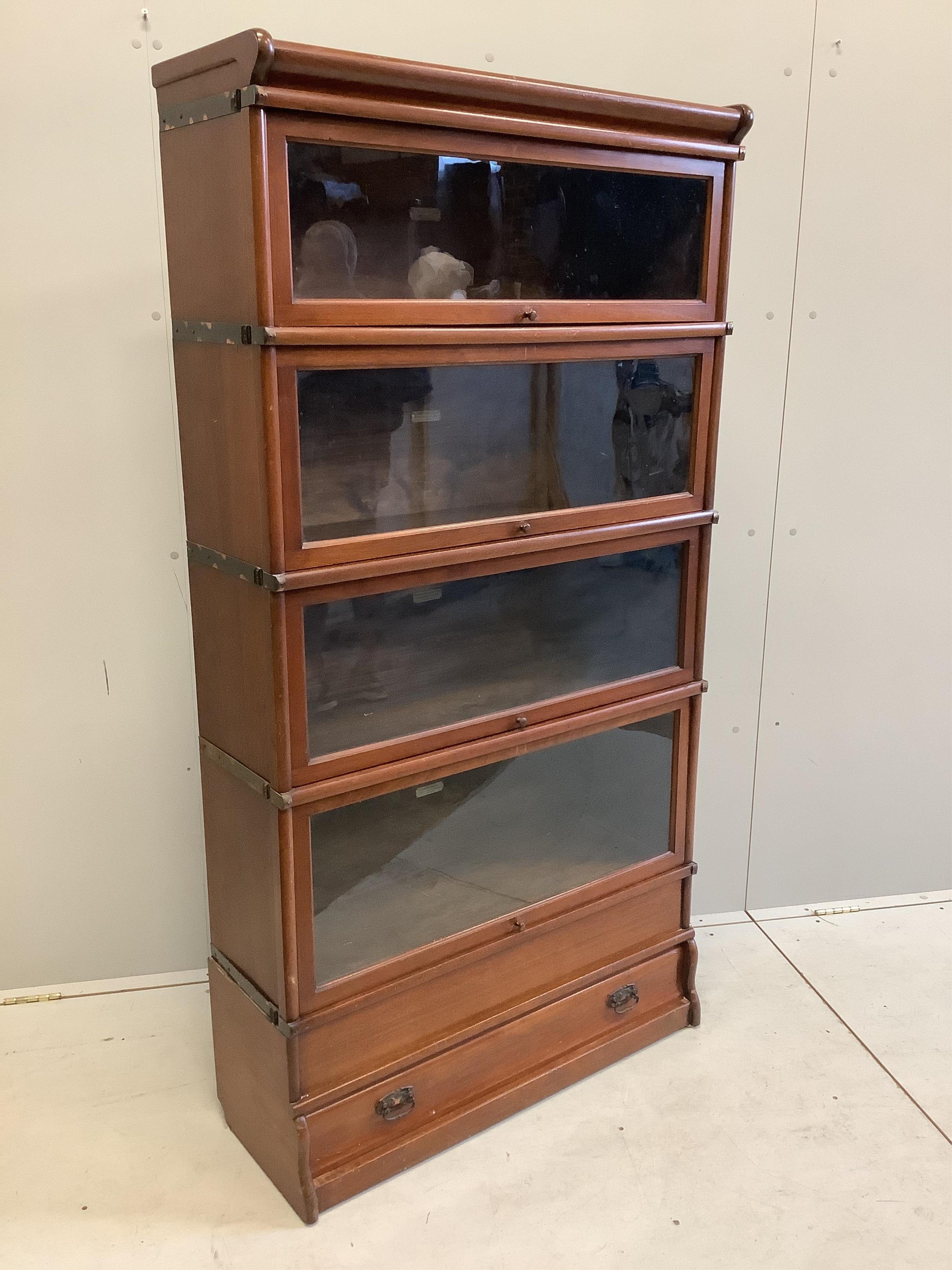 A Globe Wernicke mahogany four section bookcase, width 86cm, depth 31cm, height 165cm. Condition - fair